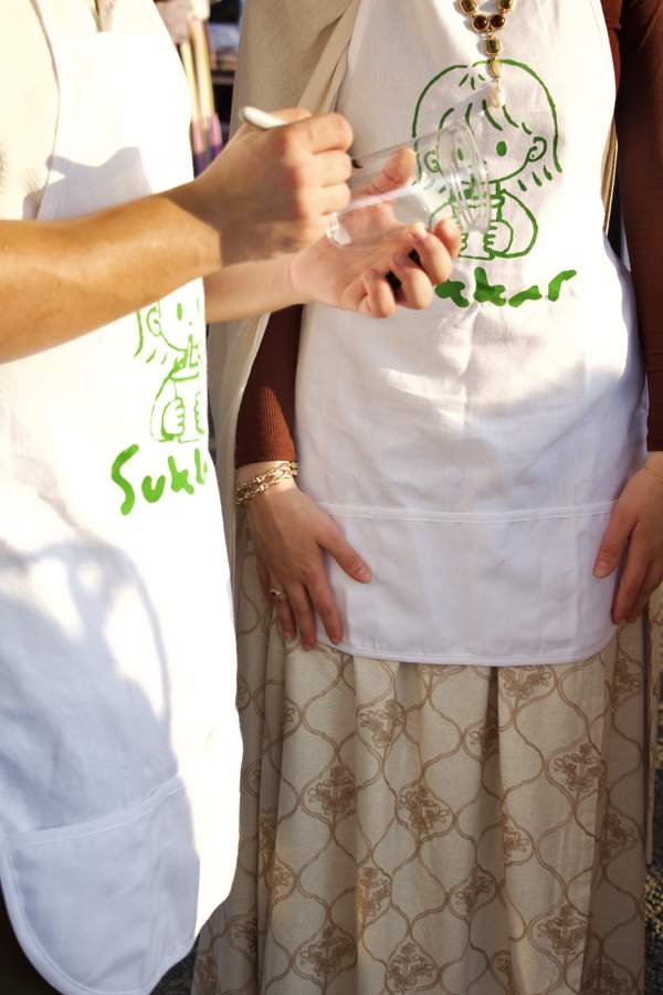 Marking a cup at the Sukkar booth